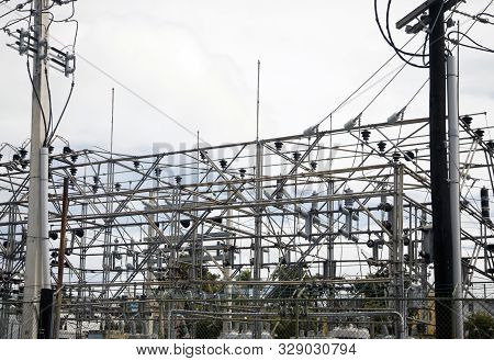 Bayamon, Puerto Rico/usa - February 15, 2019: View Of Power Grid With Poles And Wires That Provide E