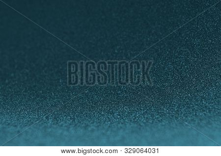 Dark Blue Sparkle Glow Bokeh Texture As Background.