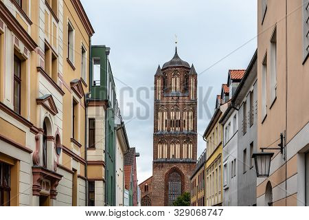 Traditional Colorful Houses And Church Tower In The Old Town Of Stralsund