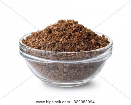 Glass bowl  of fish feeding mix isolated on white