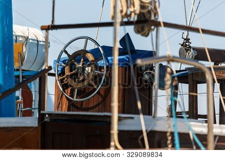 Control Wheel Sailing Yacht Without People. Depth Of Field Blur
