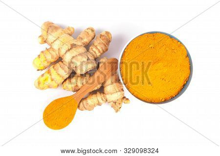 Turmeric Powder (curcuma) In Brown Bowl On White Background. Herbal