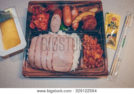 Jeju Island, South Korea, September 06, 2019: Close Up View Of Open Korean Lunchbox With Spam, Sausa
