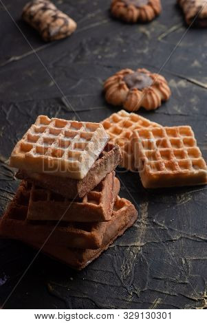 Stack Of Waffles On A Black Table, Cookies Background,