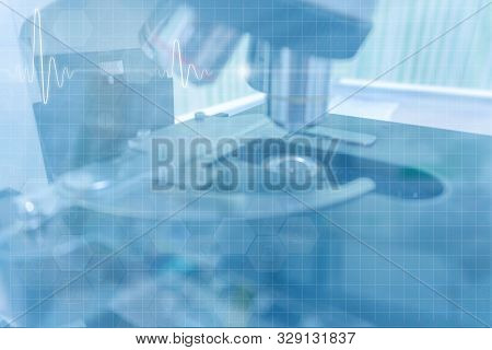 Microscope With Ekg Graph In Blue Tone