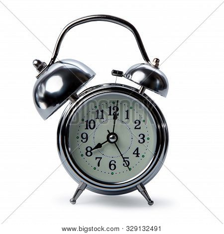 isolated retro alarm clock on white background, one big bell of alarm clock and normal side, alarmin