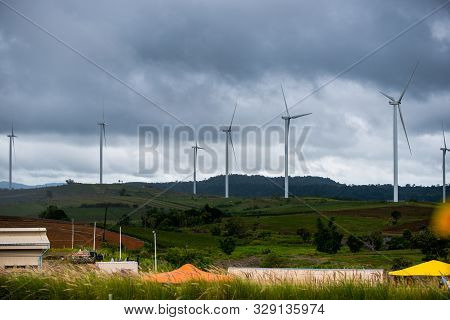 Turbine In Farm With Incoming Thunder Storm