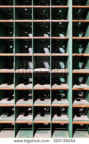 Light And Shadow In Cubbyholes In An Antique Mail Car