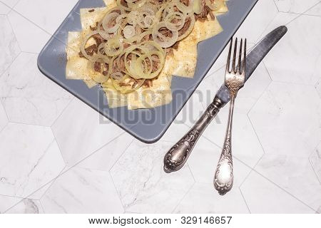 Beshbarmak Is A National Kazakh Dish - Square Pasta With Boiled Meat And Onions.