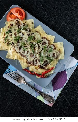 Beshbarmak Is A National Kazakh Dish - Square Pasta With Boiled Meat And Onions.