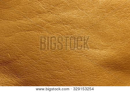 Blurred Leather Background, Ocher Color. Abstract Texture Background Out Of Focus. Abstract Light-br