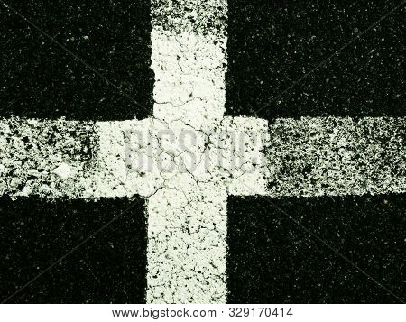 White Paint Line On Old Obsolete Asphalt Plaground. Empty Kids Areal.