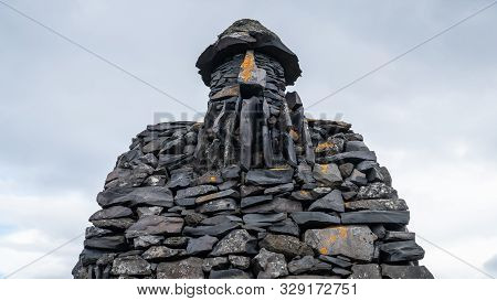Arnarstapi, Iceland - August 2019: Stone Monument To Mythological Hero Bardur Snaefellsas