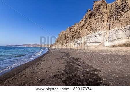 Canyon Mountains And Sea With Black Volcanic Beach On Vlychada.