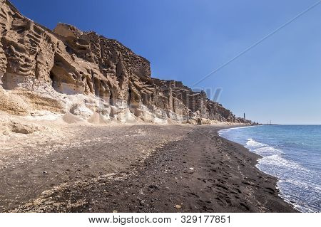 Canyon Mountains And Sea With Black Volcanic Beach On Vlychada.