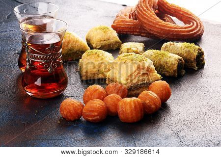 Baklava On Table. Middle Eastern Or Arabic Dishes. Turkish Dessert Baklava With Pistachio On Rustic