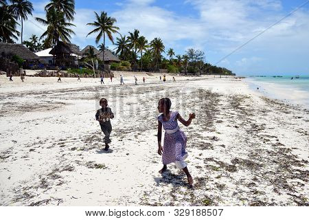 Pingwe, Zanzibar - October 6, 2019: Cheerful Happy Children Play On The Pingwe Beach, Local Village 