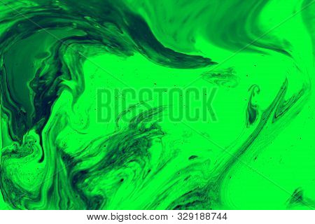Green Abstract Background. Acrylic Paint Mixed With Water Creates An Interesting Structure. The Pain