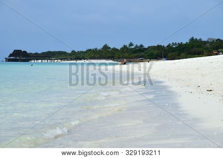 Kendwa, Tanzania - October 5, 2019: Blue Transparent Water And White Sandy Beach On Ocean Shore, Ken