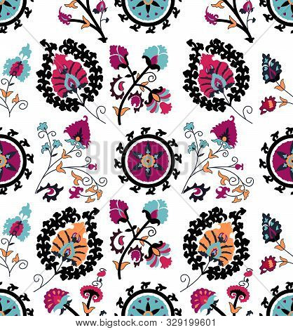 Seamless Colored Ethnic Flowers And Leaves Pattern On White Background. Designed For Textile Prints.