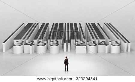 Young businessman standing in front of a big codebar