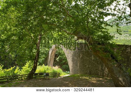 Historic Stone Arch Bridge At Zagori In Mountains In Central Greece.