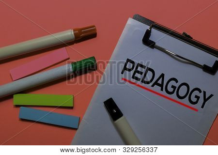Pedagogy Write On Sticky Notes. Isolated On Pink Table Background
