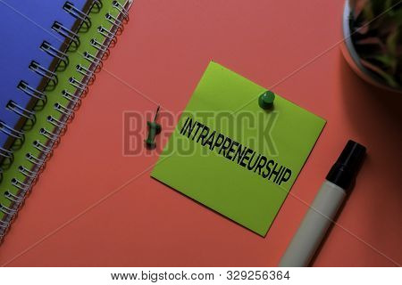 Intrapreneurship Write On Sticky Notes. Isolated On Pink Table Background