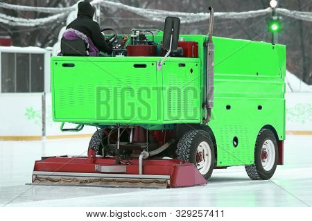 Special Machine Ice Harvester Cleans The Ice Rink. Winter Specialized Transport