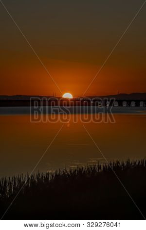 Sunrise Over A River In Petaluma Ca.