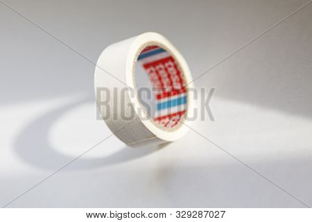 Umea, Sweden - September 28, 2019: White Tape Falling On The Table With White Background And Sunligh