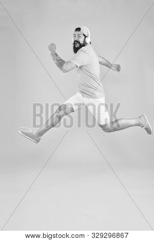 Impetuous Movement. Hipster Dancing Jumping Headphones Gadget. Inspiring Song. Music Library. Energy