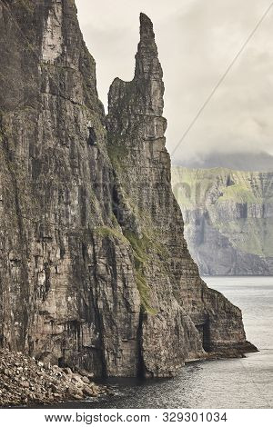 Stack In Faroe Islands, Sandavagur. Trollkonufingur In Vagar Island Coastline.