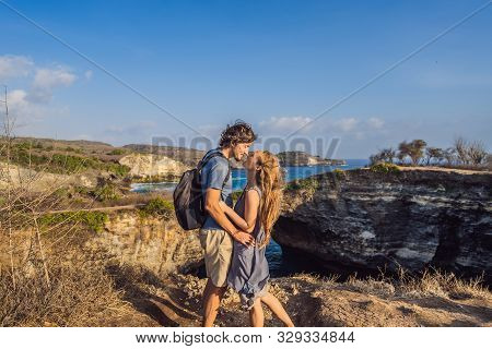 Man And Woman In Honeymoon Near Broken Beach In Nusa Penida, Indonesia Angels Billabong Beach. Popul