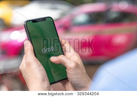 Bangkok, Thailand - October 25, 2019: Grab App, Application On Smartphone On Street Traffic For Call