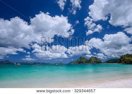 El Nido, Palawan, Philippines. Shallow Lagoon Bay , Sandy Beach And Beautiful White Cloudscape. Trav