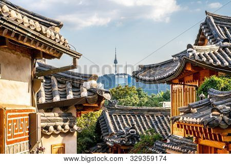 Bukchon Hanok Village In Seoul With View On Traditional Houses Roofs And Tower In The Distance In Se