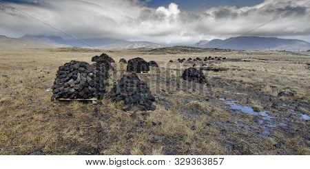 Ireland Galway,  2018 - Bogland In Ireland, With Piles Of Turf  Drying Under The Sun And Used As Ful