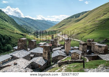 View Of The Ushguli Village At The Foot Of Mt. Shkhara. Picturesque And Gorgeous Scene. Rock Towers