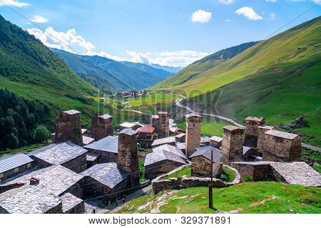 View Of The Ushguli Village At The Foot Of Mt. Shkhara. Picturesque And Gorgeous Scene. Rock Towers