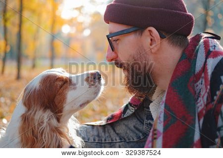 Portrait Of A Young Man And Cocker Spaniel Enjoying Time Together. Сoncept Of Close Friendship And L
