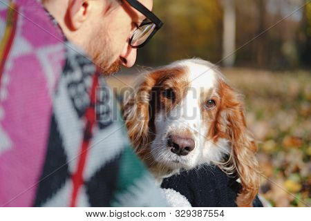 Portrait Of A Young Man And Cocker Spaniel On Autumn Background. Сoncept Of Close Friendship And Lov