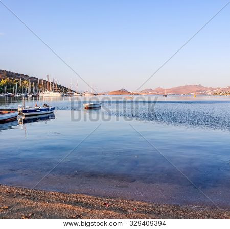 Beautiful Sunrise On The Aegean Sea With Islands, Mountains And Boats