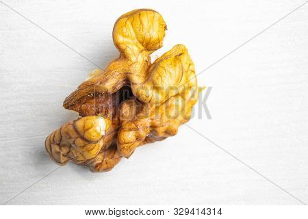 Cleaved And Whole Walnuts On A Light Wooden Background. The Concept Of Healthy Organic Food. Place F