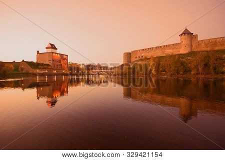 October Twilight On The Border Narva River. The Border Of Estonia And Russia