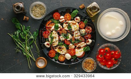 Ingredients For Italian Caprese Salad. Mozzarella Balls, Tomatoes, Basil Leaves, Olive Oil With Bals