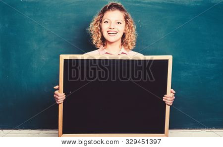 Breaking News. Teacher Cheerful Woman Hold Blackboard Blank Copy Space. School Information Concept. 