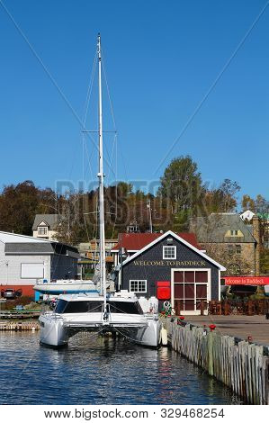 Pier With Docked Catamaran With Welcome To Beddeck Signs For Boaters, In Cape Breton, Nova Scotia Ca