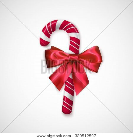 Striped Red And White Chrisrmas Candy. Realistic Sweet Stick With Silk Bow. Confection For Christmas