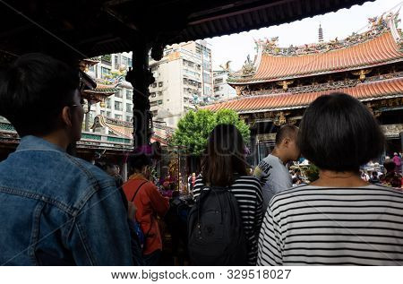 Taipei, Taiwan - October 20th, 2019: people praying in Lungshan temple at Taipei, Taiwan